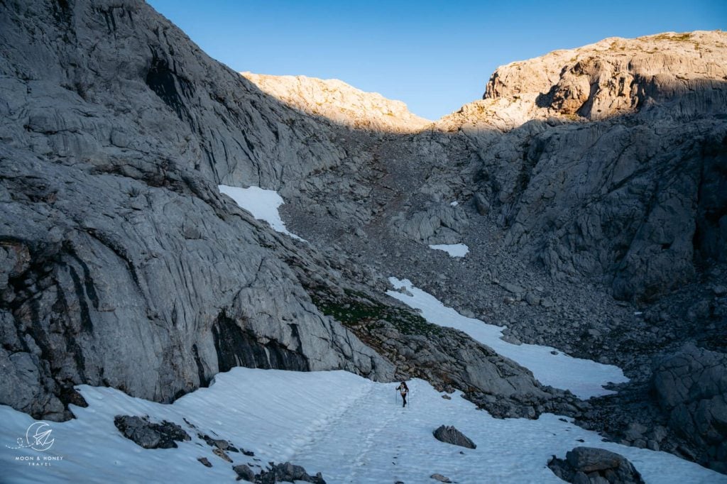 Refugio Jou de los Cabrones to Horcada Arenera hiking trail snow field, Picos de Europa, Spain