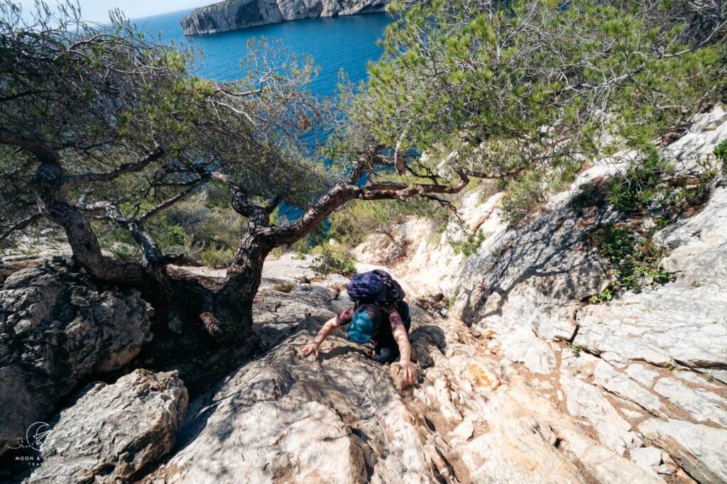 Vertical rock step scramble between Calanque de Sugiton - Calanque de Morgiou, France